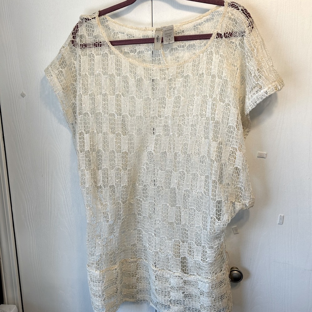 Off white mesh or lacy top.